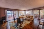 Open floor plan main living area/Living Room with lovely large windows and glass patio doors to the deck overlooking the lake